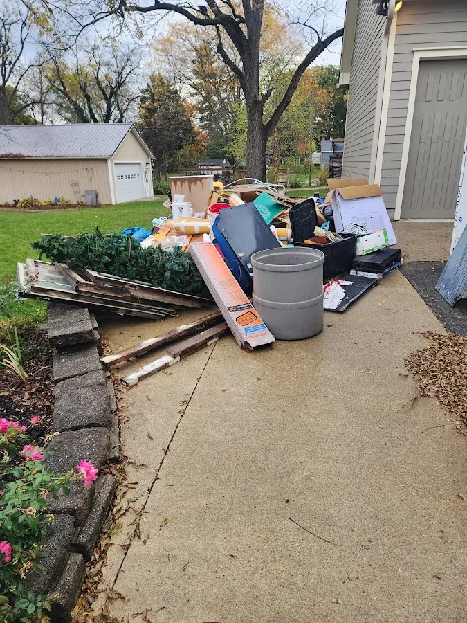 Dumpster being loaded with debris for Roofing Dumpster Rental in Mahoning